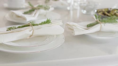 Christmas table setting with plates and napkins ready for a festive dinner