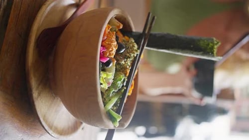Healthy Salad in Wooden Bowl Served Vertically