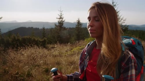 Joyful Woman Hiking in Green Mountains