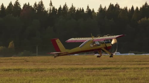 Moscow Russia CIRCA 2022 Bright Yellow Plane Pulls Glider on Cable Accelerating It to Required Speed
