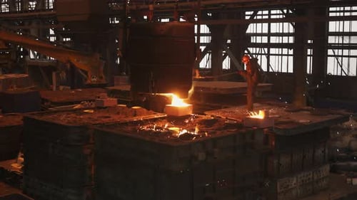 Foundry Worker Pouring Molten Metal Into Mold Stock Clip