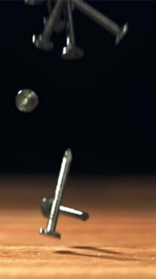 Nails Fall on the Carpenter's Worktable Filmed on a Highspeed Camera at 1000 Fps