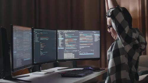 Asian Male Programmer Stretching While Creating Software Engineer Developing App, Program