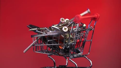 Closeup of Shopping Cart Trolley with Screws Construction Tools Repair Tools