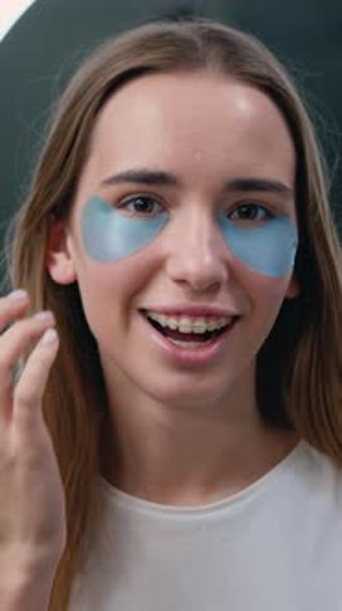 Woman Applies Under-Eye Patches for Beauty Treatment