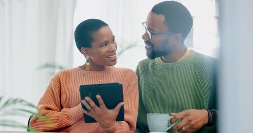 Couple Using Tablet Together at Home