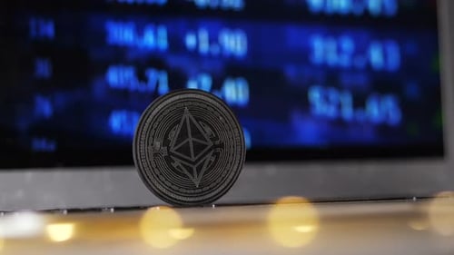 Close Up Famous Ethereum Coin Model Against Screen