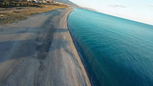 Diving Into The Line Dividing Beach And Sea Water