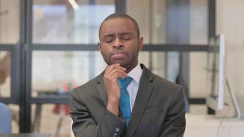 Man in Suit Has An Idea in Office