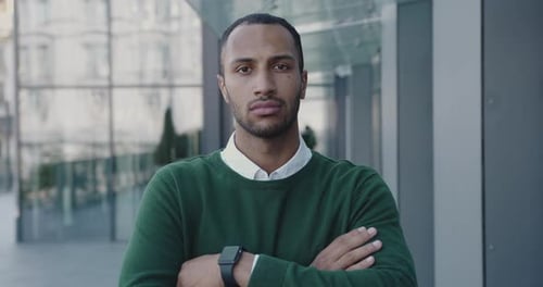 Portrait of Serious Multiracial Manager Standing Looking Camera Outside