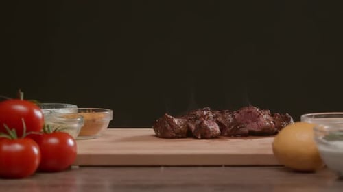 Juicy Steak with Fresh Ingredients on Cutting Board