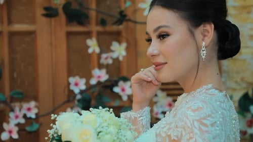 Elegant Woman with Bouquet in Decorated Home