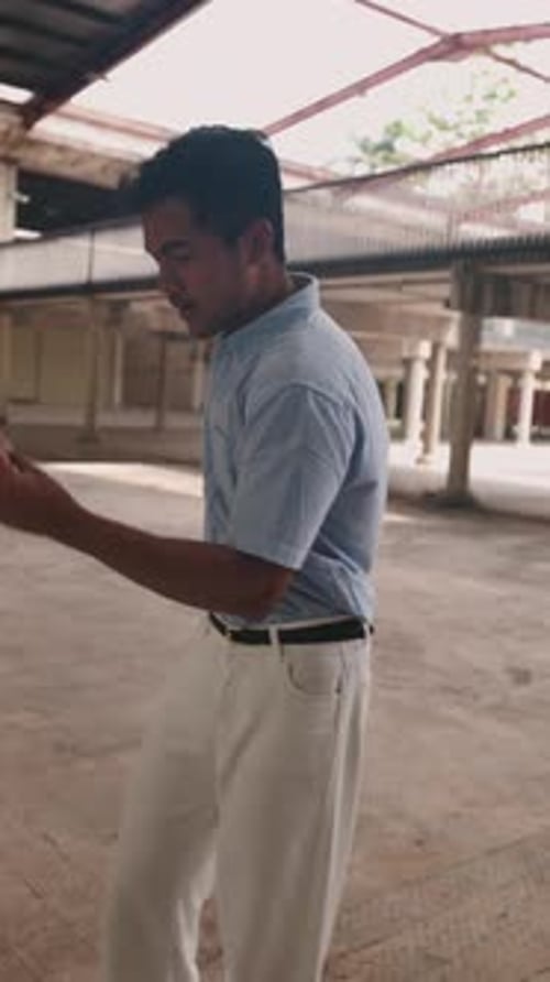 Young Man Dances Indoors with Energy and Style