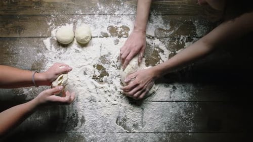 Bakers Knead Dough on Wooden Table Slow Motion Upper View