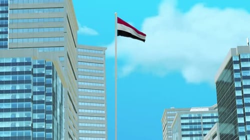 Yemen National Flag Waving Over Modern City Buildings