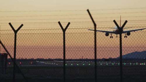 Airplane Landing to Airport Runway at Sunset Plane Arrivals International Airport Spotting Boarding