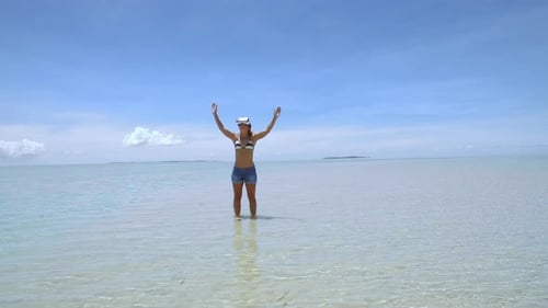 Woman Using VR Headset on Tropical Beach