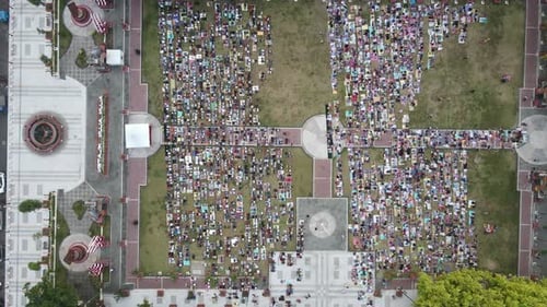 An aerial footage of Muslim congregation praying Eid in the field