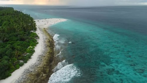 Maldives Island with Beach and Ocean with Waves Aerial View