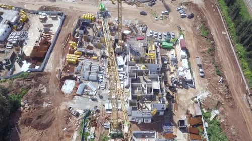 Large residential construction site with cranes, Aerial view