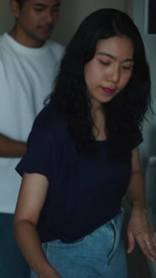 Woman and Man Smile at the Microwave