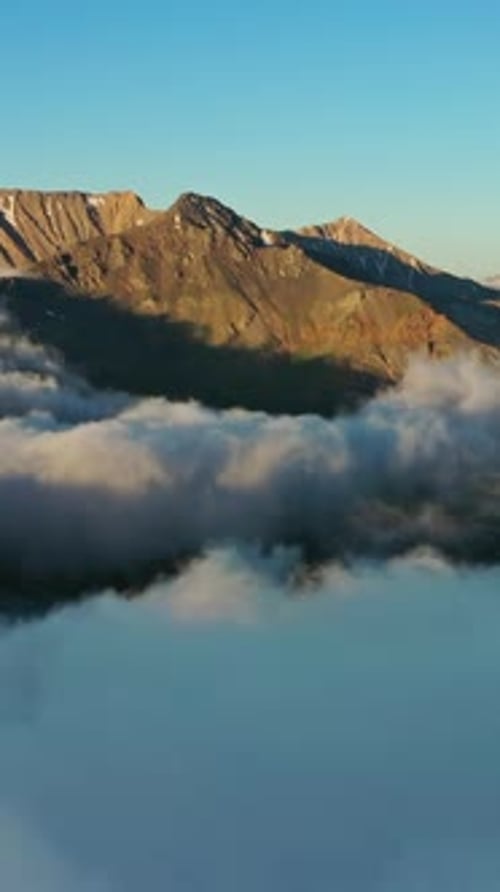 Aerial View of Clouds and Mountains at Sunrise
