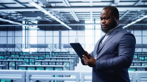 IT Professional in Server Hub Monitoring Server Mainframes Using Tablet