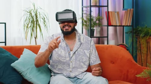 Man Experiencing Virtual Reality on Couch at Home