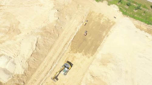 Construction Vehicles Working on Rural Site Aerial View