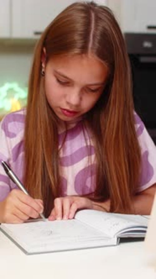 Teenager Girl Focused Homework Solves Math Task From Book Writes Notes in Notebook Serious Focus Big