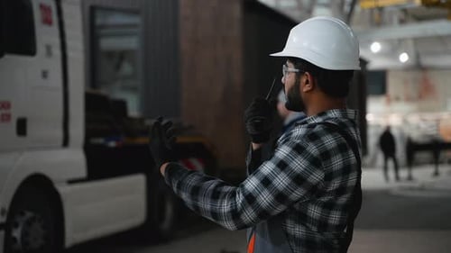 Construction Worker Coordinating Modular Home Transport Logistics