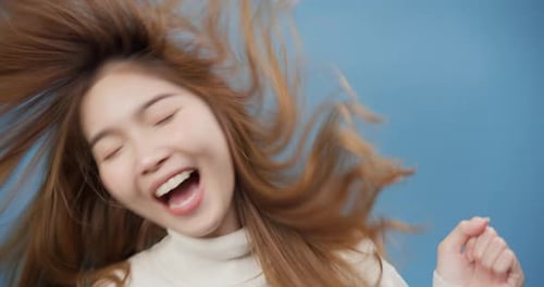 Joyful Woman Shakes Head and Dances Close Up