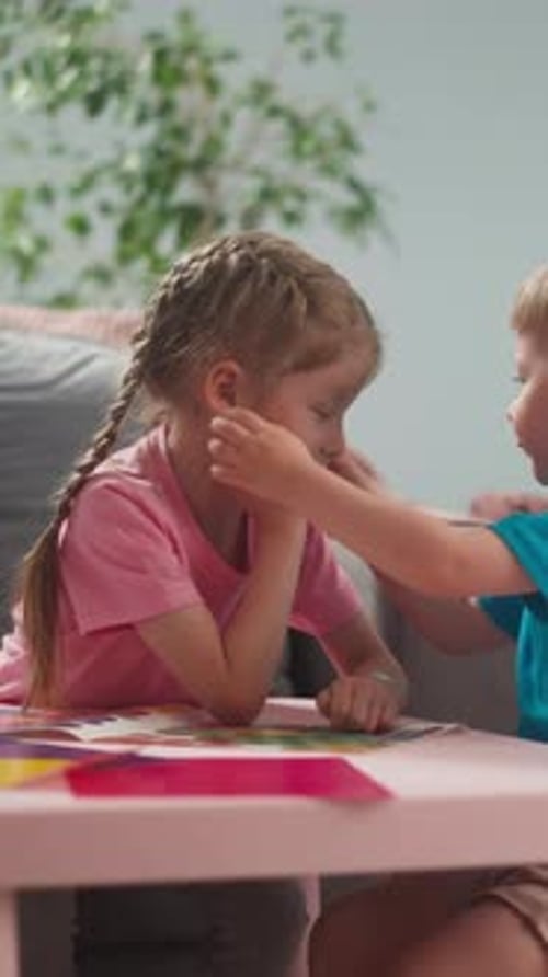 Girl Gets Face Painted by Friend at Home