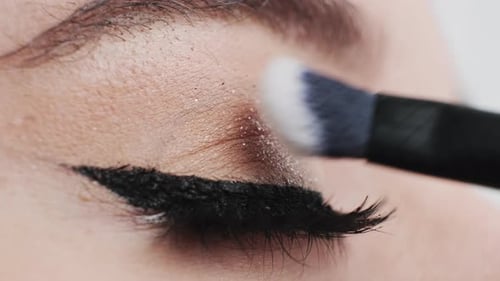 Applying Glittery Eye Shadow with Brush, Close-Up