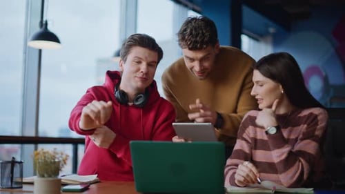 Enthusiastic Team Having a Video Conference in Office