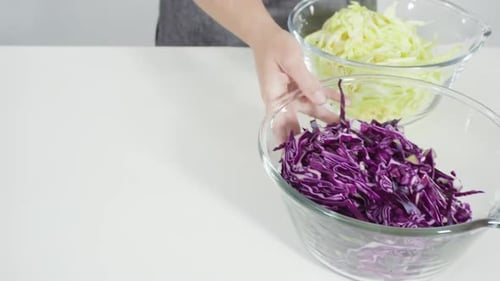 Preparing Three Bowls of Cabbage and Onions
