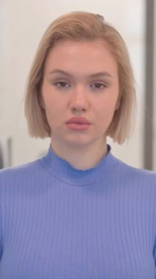 Portrait of Serious Young Woman in Office, vertical video