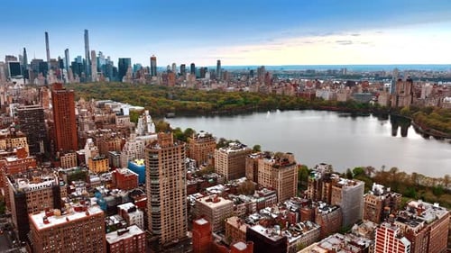 View of the Central Park surrounded by beautiful urban architecture. Top perspective on New York