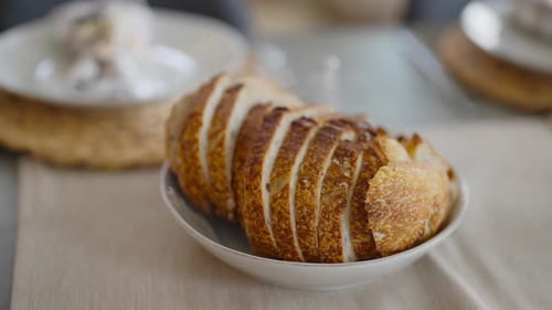 Close up of sliced bread in shallow bowl