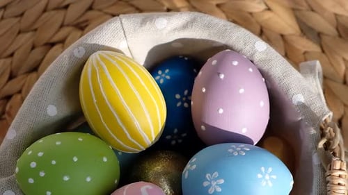 Painted Easter Eggs in Woven Basket for Holiday
