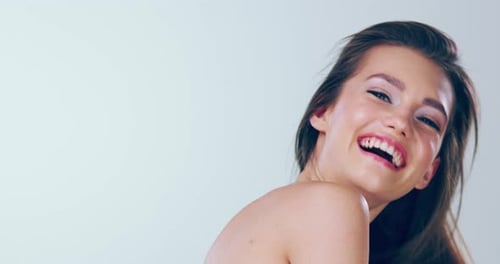 Smiling Woman Turns to Look over Shoulder