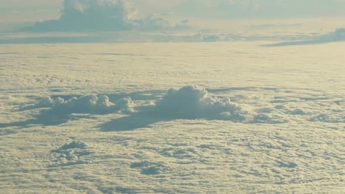 Scenic Aerial View Over the Clouds in Daytime