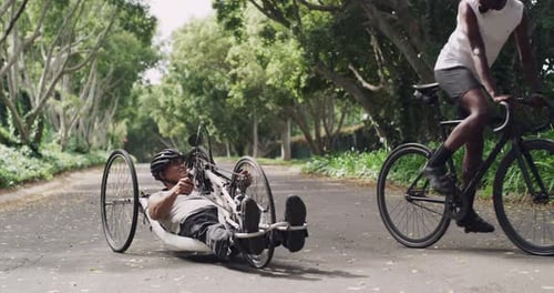 Man, paraplegic and hand riding tricycle in park, forest or road for fitness, health and wellness