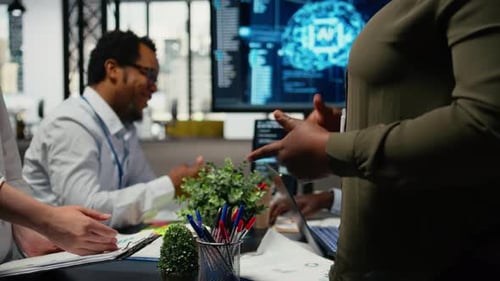 Programmer Shaking Hand with Businessmen in Tech Agency Boardroom