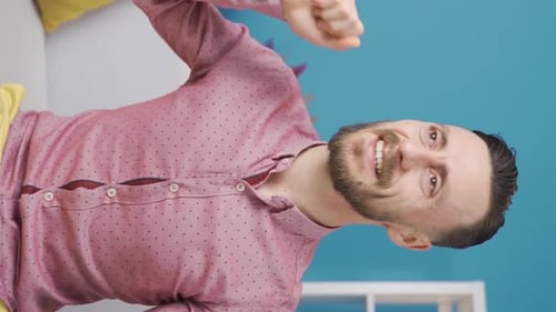 Bearded Man Smiles and Celebrates, Vertical Video