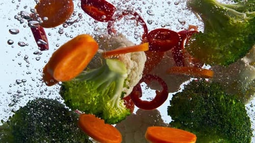 Mix Fresh Vegetable Falling in Water Super Slow Motion Closeup
