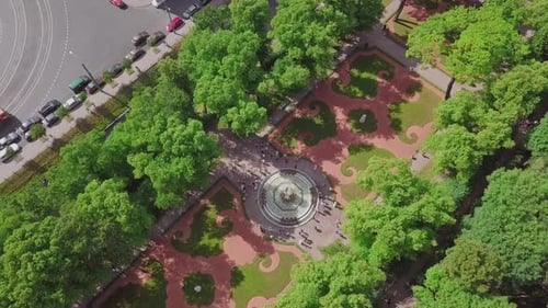 Summer Garden, an aerial drone fly by of a beautiful Koronniy (Crowning) fountain from top, people v