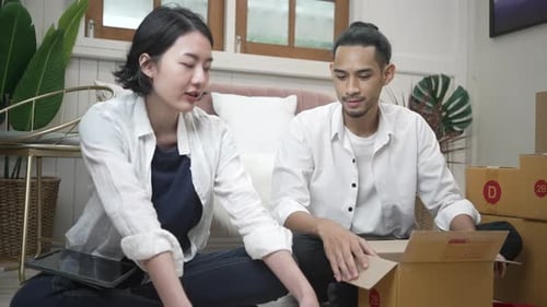 Young couple packing products and send to customers.