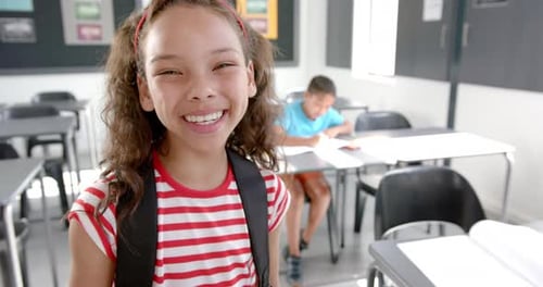 Happy Girl Smiling in Classroom