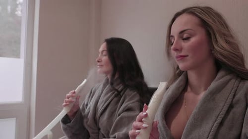 Couple of Young Woman Enjoying in Inhalation Treatment in Wellness Spa Center
